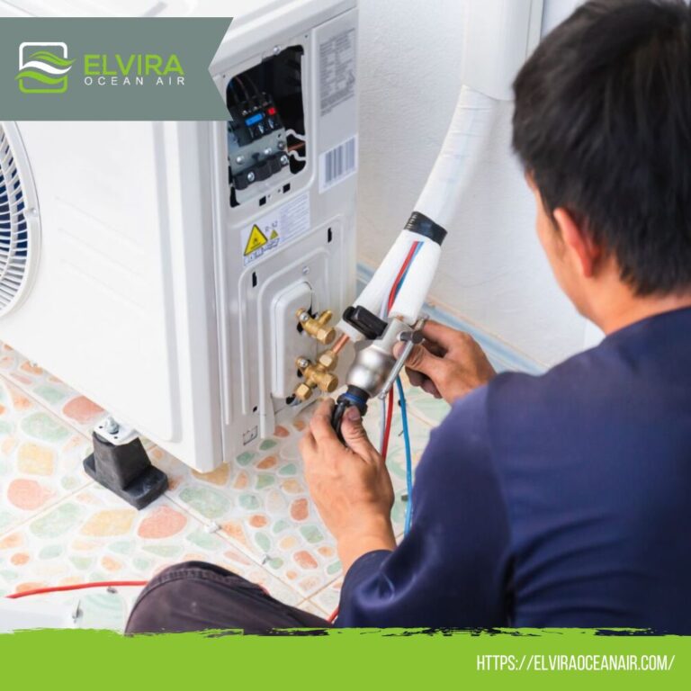 Technician servicing the piping of a wall-mounted indoor unit