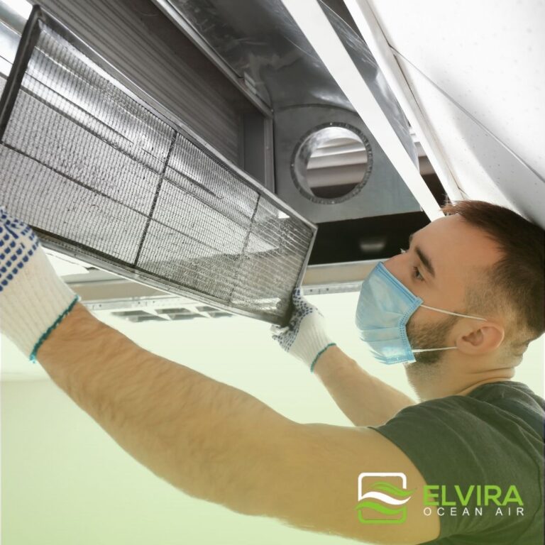 Technician servicing an indoor air handler