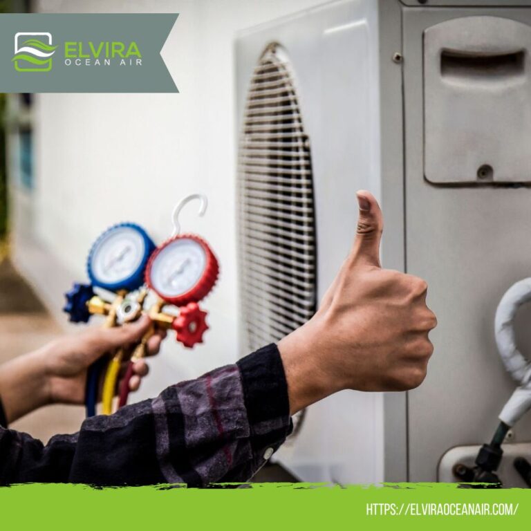 Technician next to refrigerant gauges giving a thumbs up